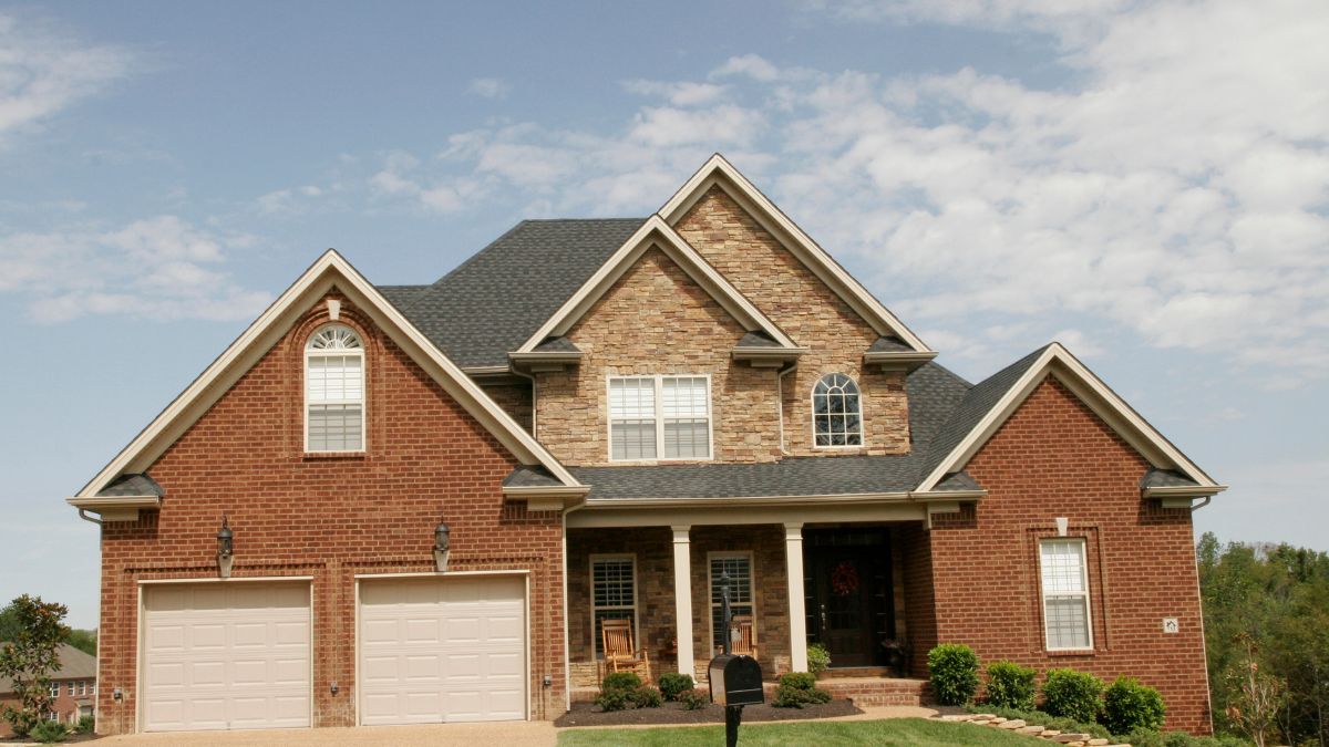 Website%20Dev.%20-%202024-11-04T112314.209 the outside of a brick home